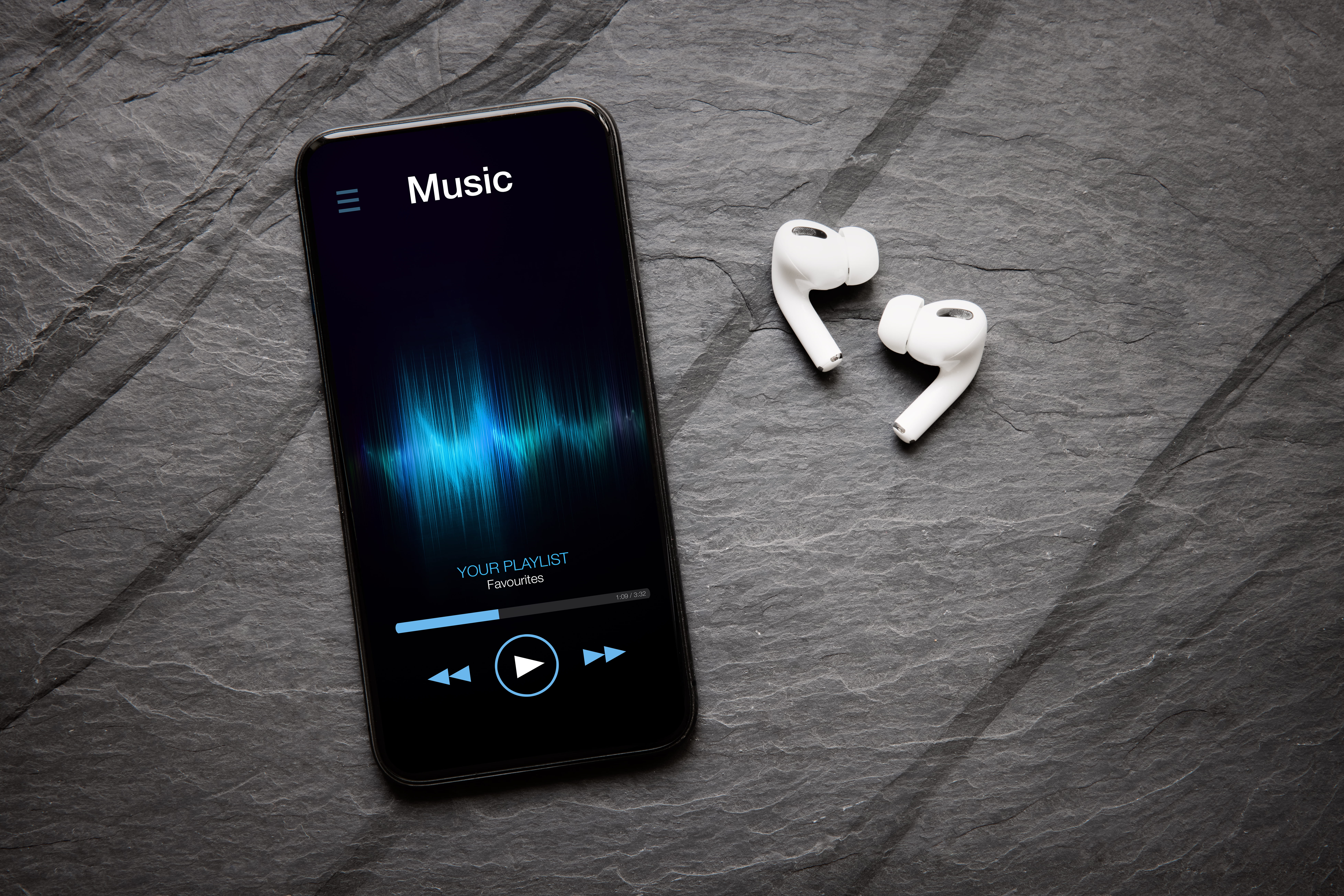 music showing on phone and earpods shutterstock_1931855198